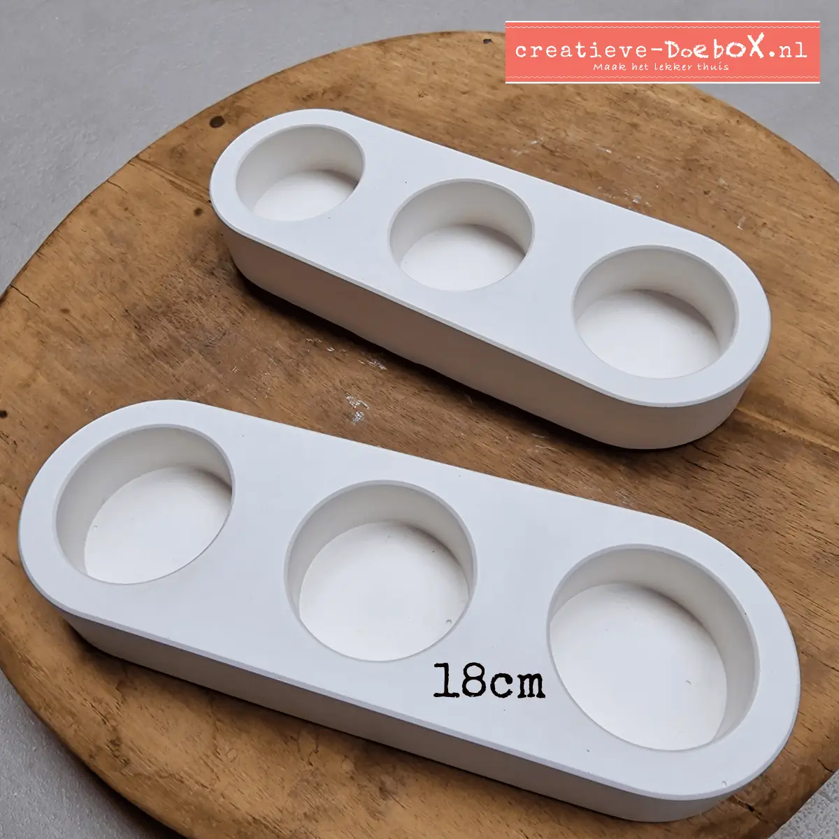 waxinelichtjes met drie op een rij